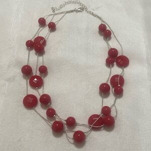 NWOT 3 strand beaded necklace with adjustable clasp. Never worn